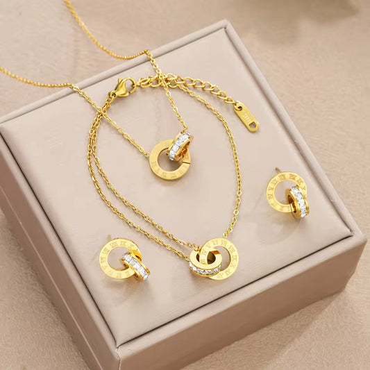 4-Piece Gold Stainless Steel Jewelry Set – Interlocking Circles & Roman Numerals. Queen D LA